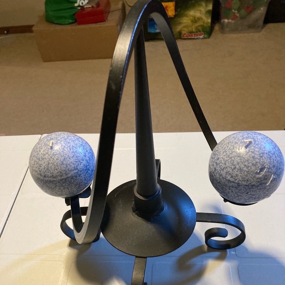 Unique Cast iron balancing candle holder. NEW Makes a great gift!